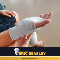 Personal injury victim with bandaged hand and leg