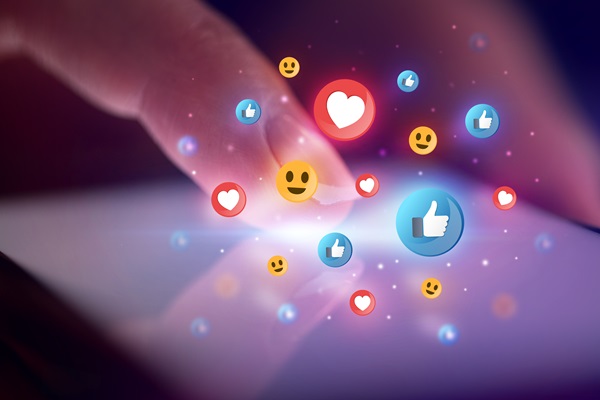 Finger touching phone with social media concept and dark background.